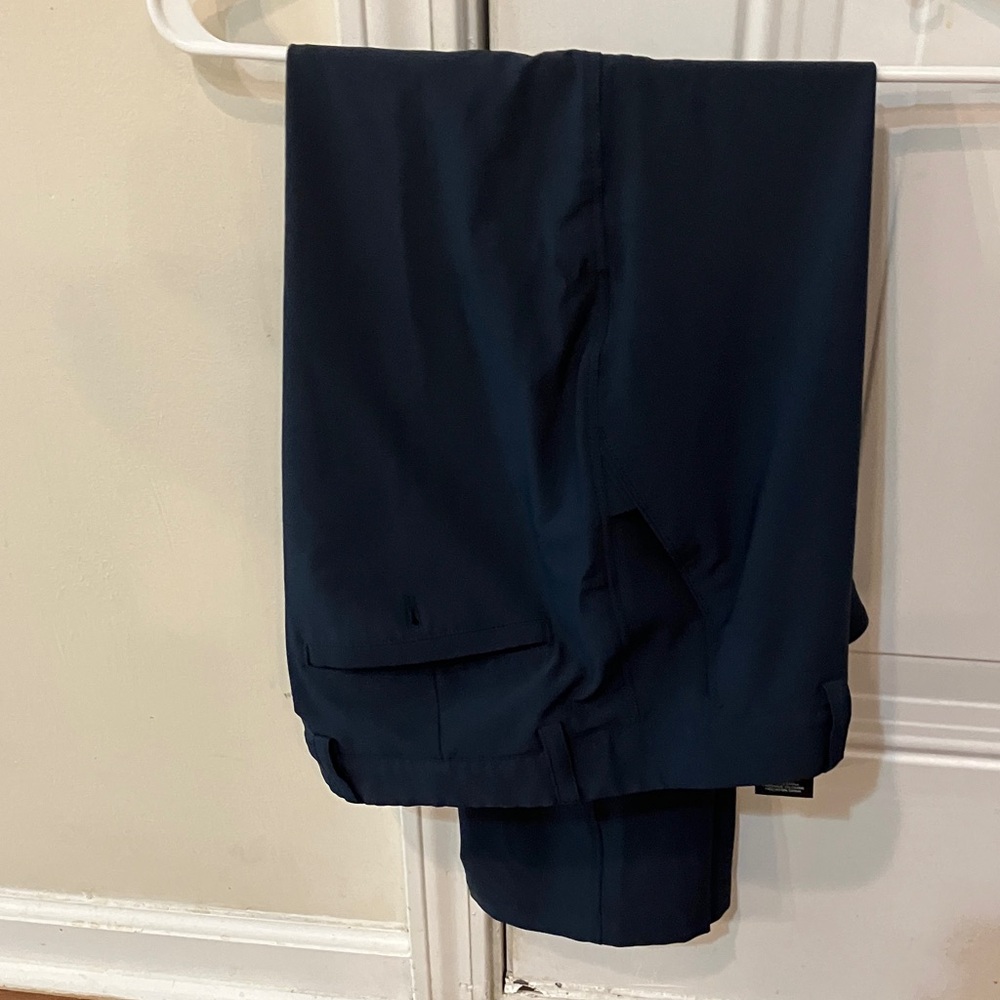 Greg Norman navy golf pants.